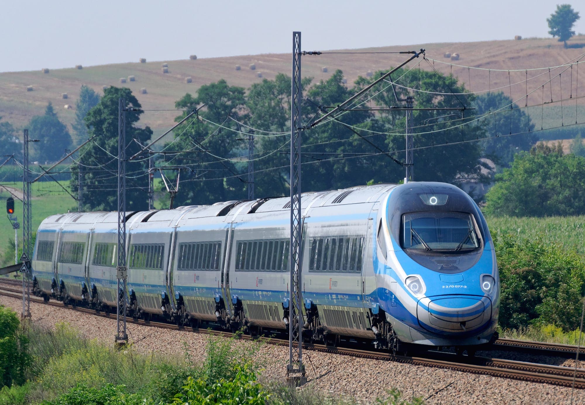 A PKP Intercity Pendolino train crossing the Polish countryside